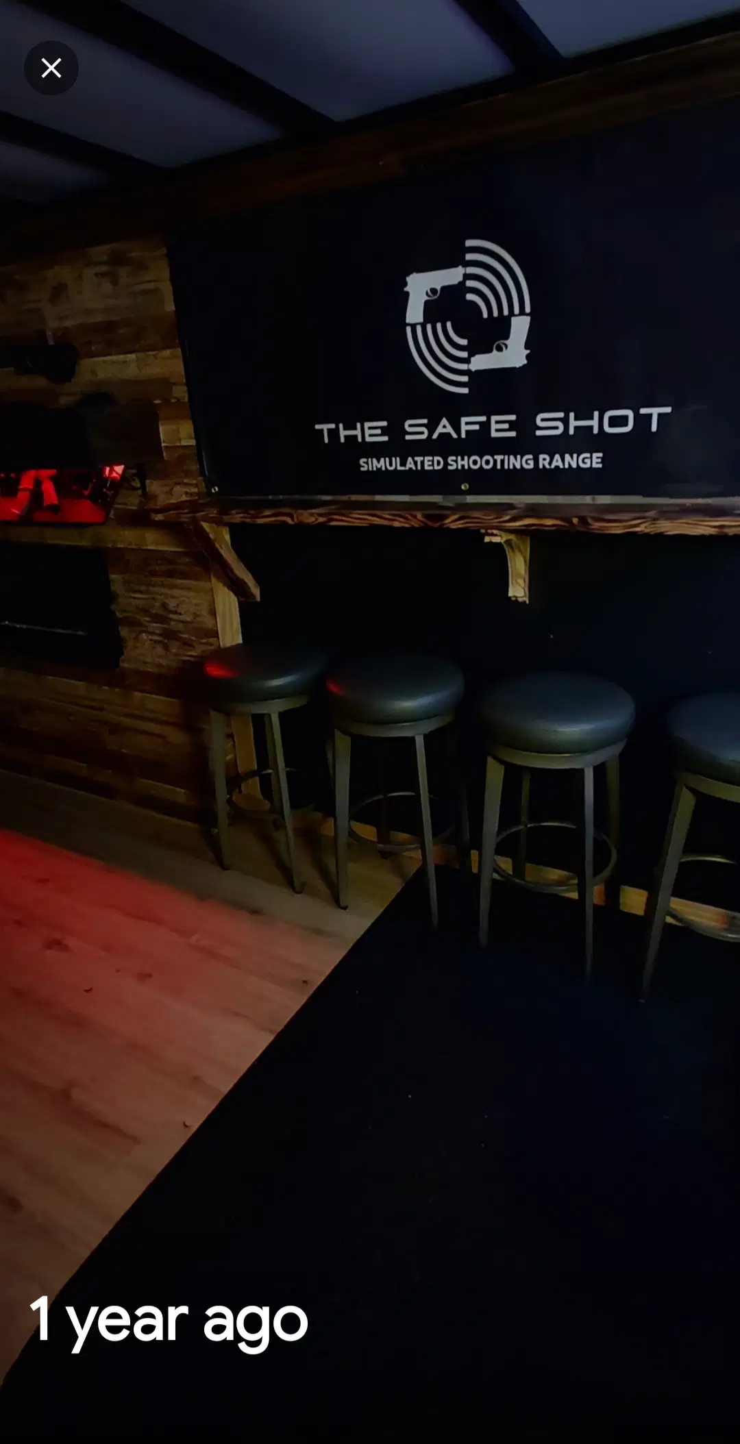Safe Shot simulated shooting range sign and training stations inside the mobile setup